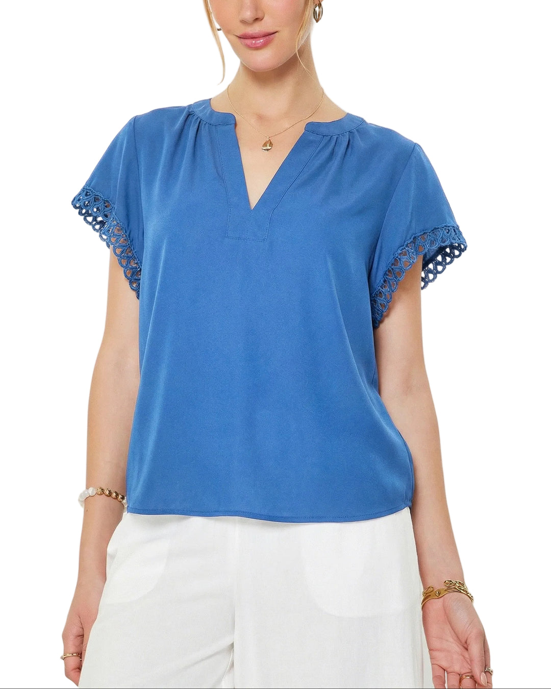 Effortless elegance meets comfortable style with the Callie Crochet Detail Top. This short sleeve v-neck features delicate crochet detailing that adds texture and visual interest to an otherwise timeless silhouette. Perfect for layering or wearing solo, the relaxed fit and breathable fabric make it ideal for warm weather days. Pair with your favorite jeans or linen pants for an understated, polished look.