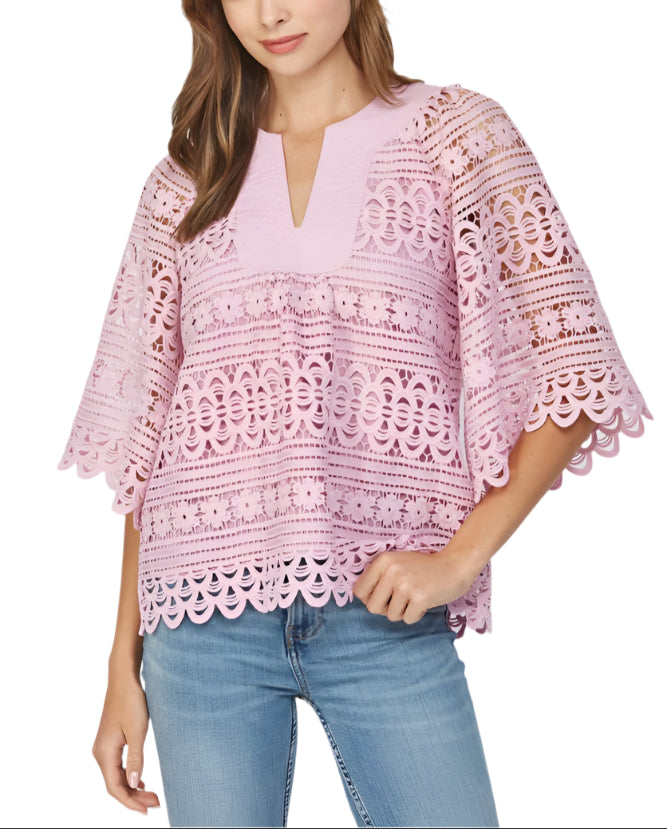 Add a touch of whimsy to your wardrobe with the Lily Eyelet Floral Lace Top in Lilac. This playful top features delicate eyelet floral lace that brings a fresh, feminine vibe to any outfit.