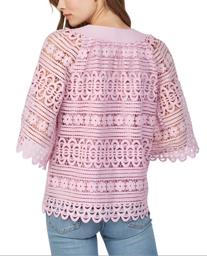 Add a touch of whimsy to your wardrobe with the Lily Eyelet Floral Lace Top in Lilac. This playful top features delicate eyelet floral lace that brings a fresh, feminine vibe to any outfit.