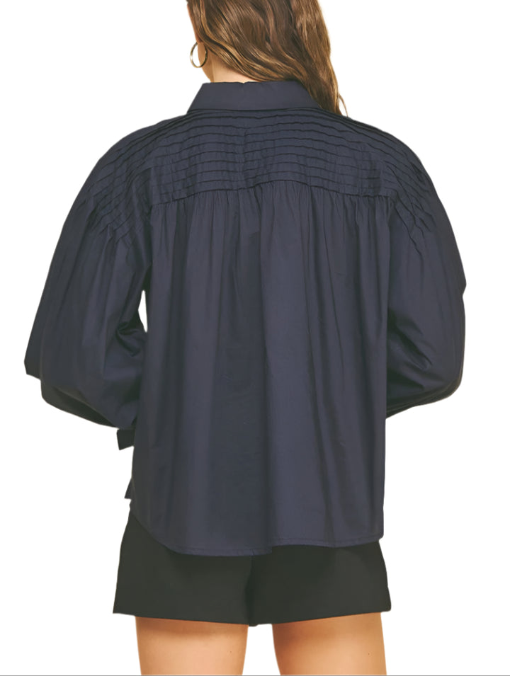 Add a touch of charm to your wardrobe with the Marney Detail Blouse. Featuring a playful tucked design and a sweet tie detail at the cuffs, this top brings effortless style and a flirty finish to any outfit. Perfect for days when you want to feel both comfortable and cute!