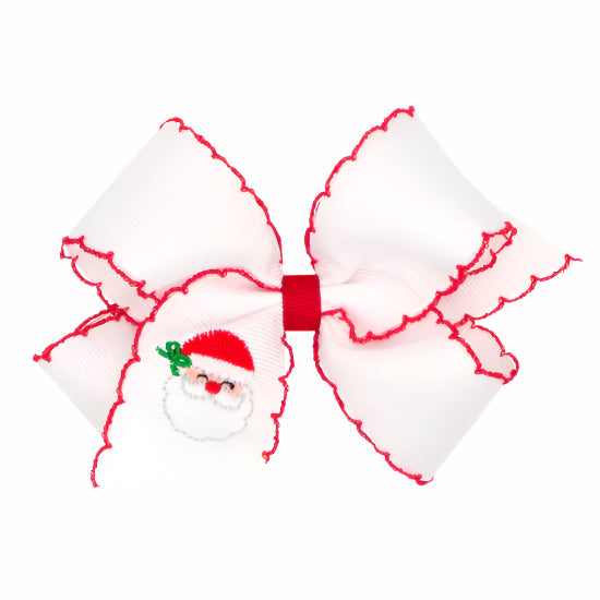 Christmas-themed hair bow with Santa Claus design on a white background
