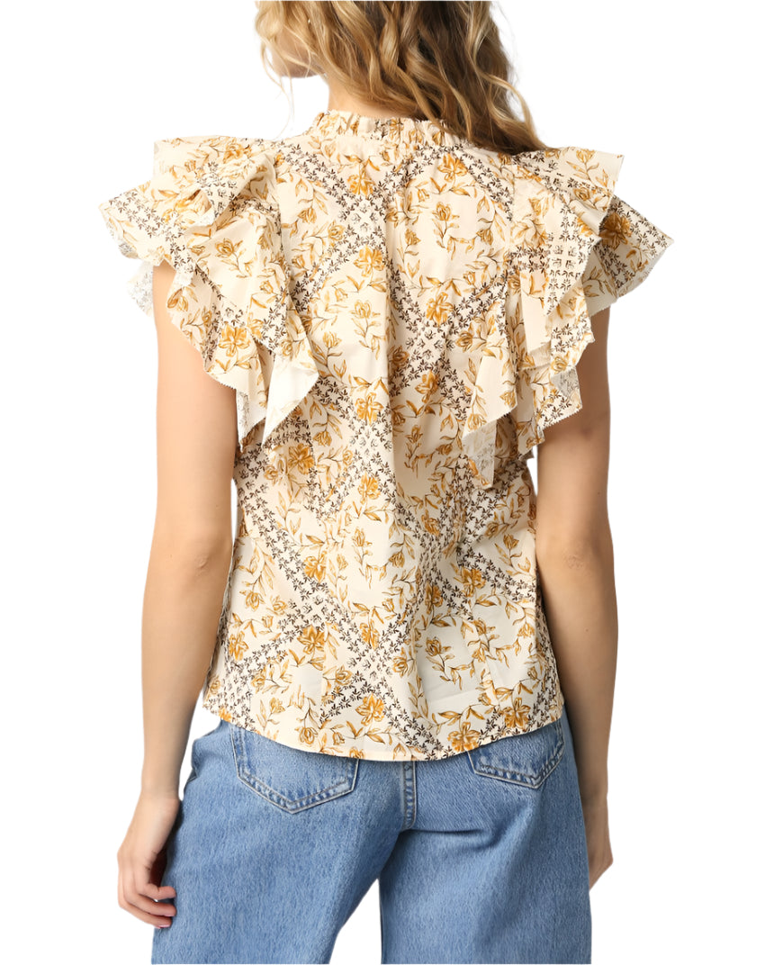Our Senna Ruffled Shirt features a ruffled hem and a strap detail.
