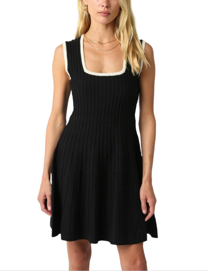 Our Noma Line Dress features a square neck and an A line shape.
