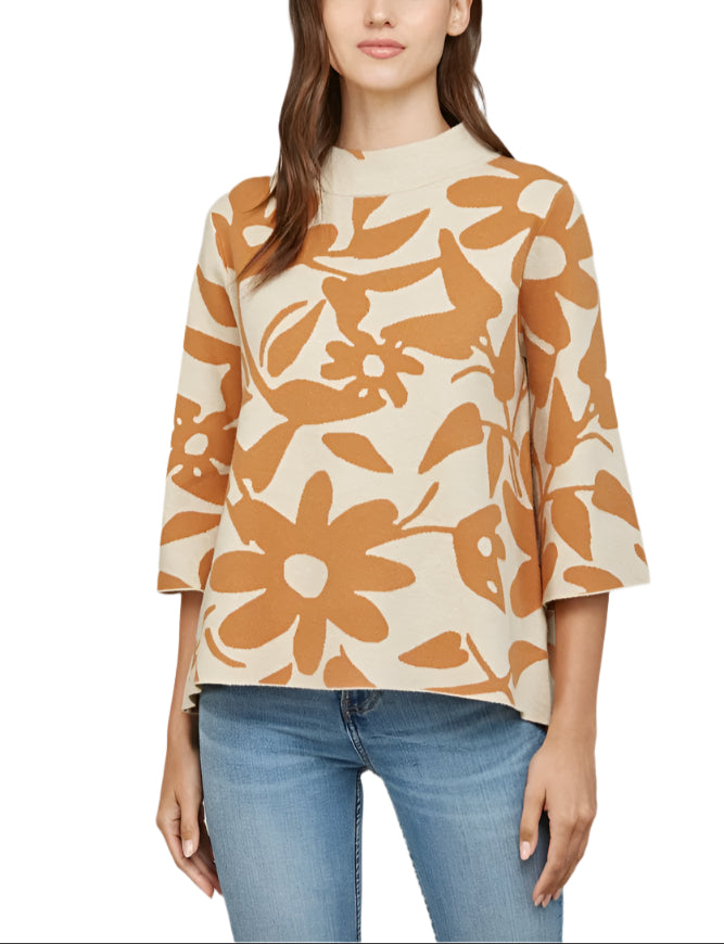 Embrace cozy charm with the Sasha Floral Pattern Sweater in Taupe/Camel. This playful jacquard knit features delicate floral designs that dance across the fabric, while bell sleeves add a fun, flirty flair.