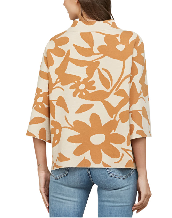 Embrace cozy charm with the Sasha Floral Pattern Sweater in Taupe/Camel. This playful jacquard knit features delicate floral designs that dance across the fabric, while bell sleeves add a fun, flirty flair.