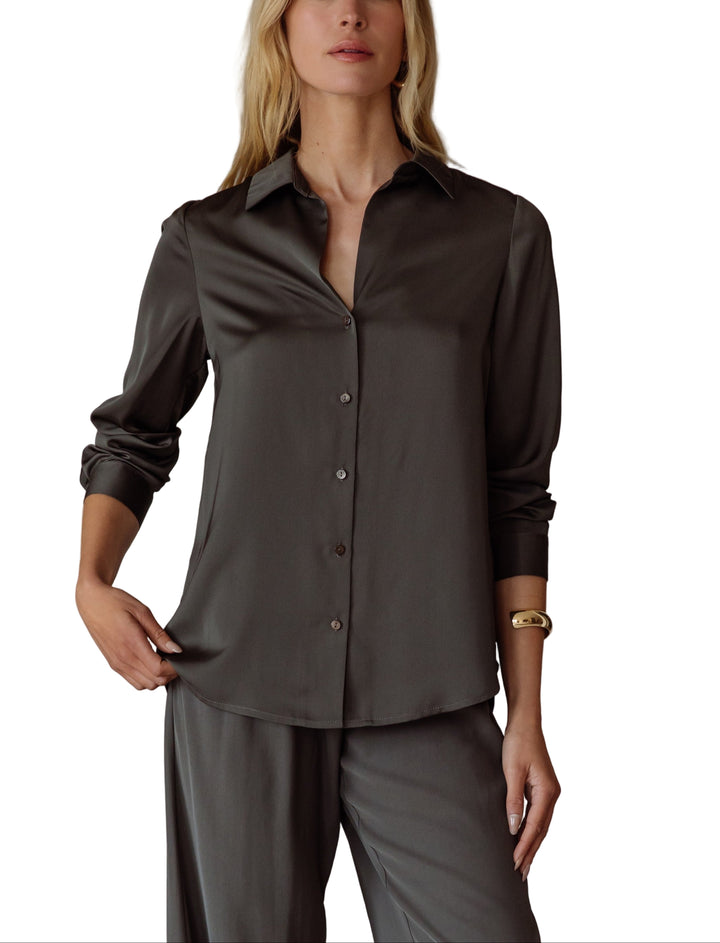 Elevate your style with the Annie Satin Blouse—a silky, long-sleeve delight that feels like a dream on your skin. Its smooth satin finish catches the light just right.