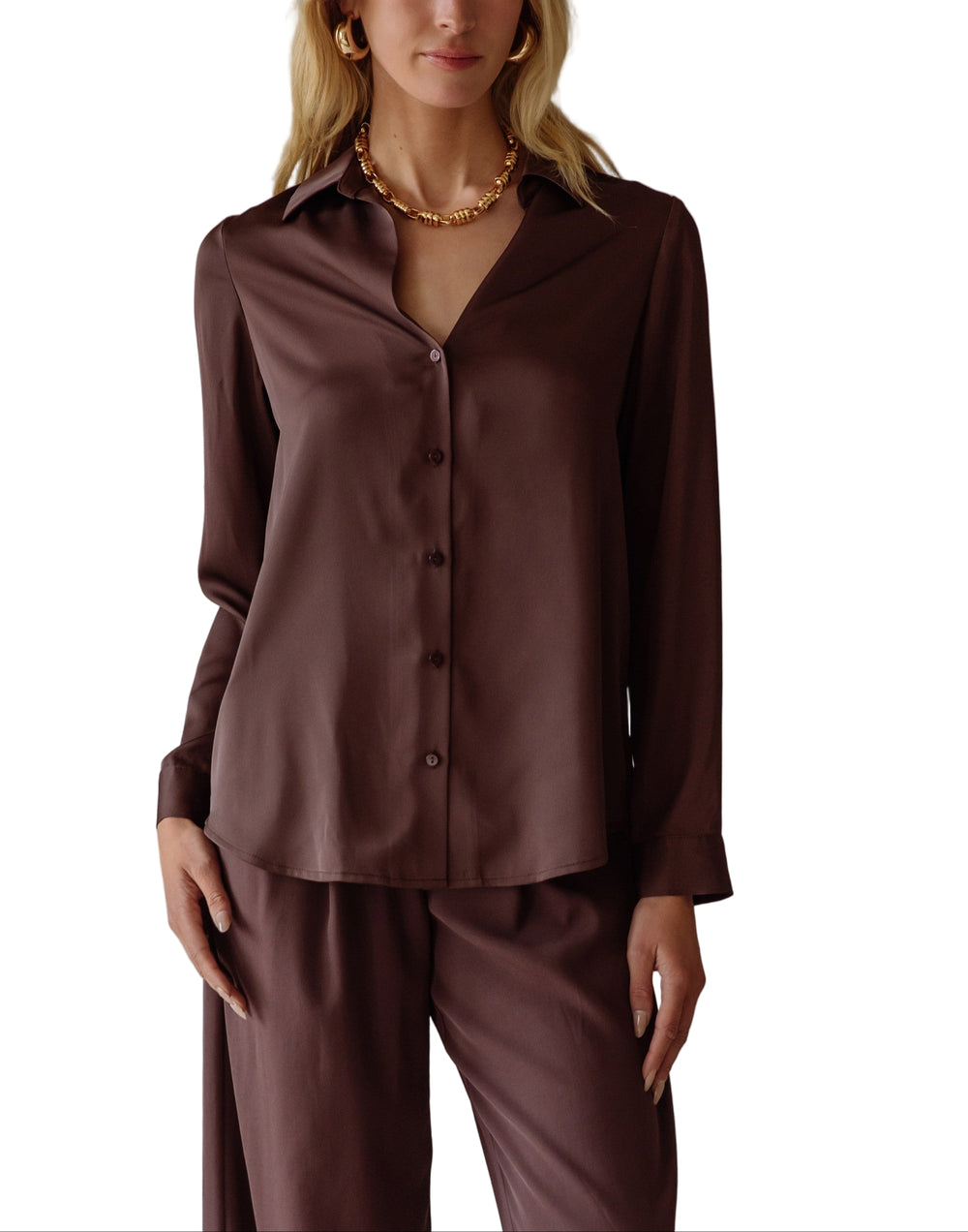Elevate your style with the Annie Satin Blouse—a silky, long-sleeve delight that feels like a dream on your skin. Its smooth satin finish catches the light just right.