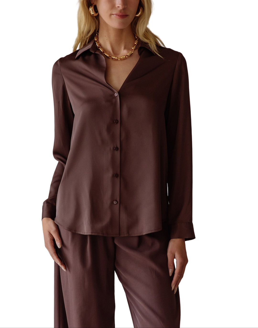 Elevate your style with the Annie Satin Blouse—a silky, long-sleeve delight that feels like a dream on your skin. Its smooth satin finish catches the light just right.