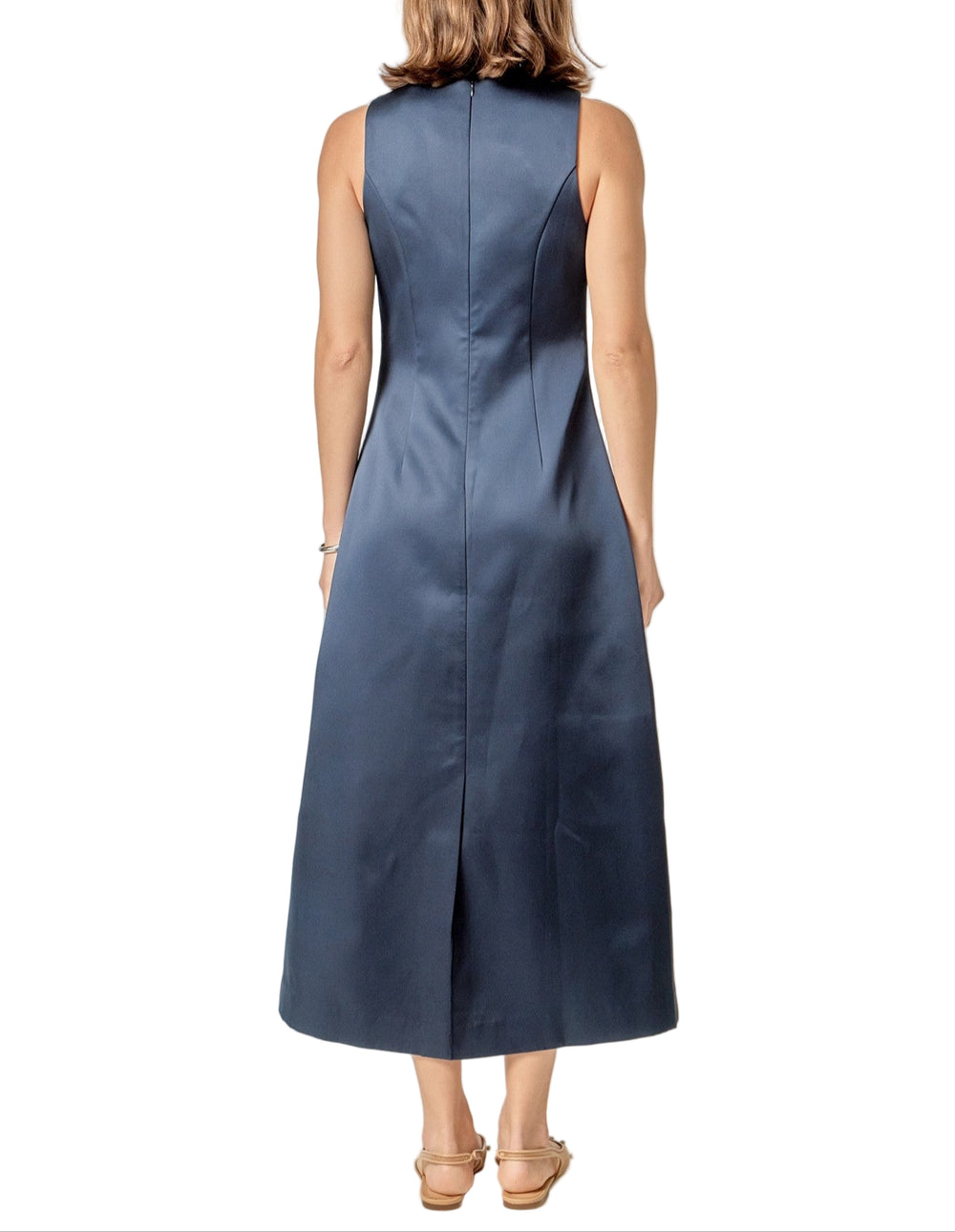 Slip into the Margo Satin Midi Dress and let the playful charm take over. This sleeveless beauty shines with a smooth satin finish that catches the light perfectly as you move. Its flattering midi length makes it easy to dance the night away or turn heads at any occasion. Effortless elegance meets fun in one stunning dress!