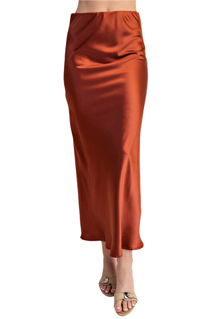 Slip into the Jacie Midi Skirt and let the playful charm of its satin sheen brighten your day. Featuring a comfy waist elastic band, this skirt moves with you, blending effortless style with all-day comfort.