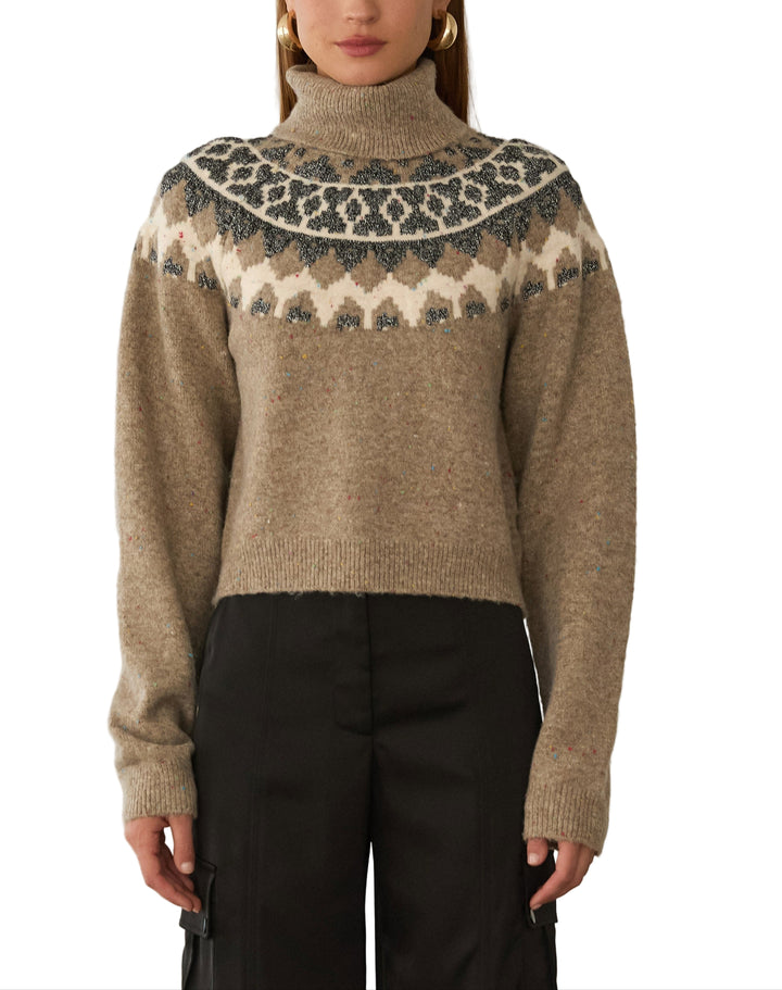 Wrap yourself in cozy charm with the Anastasia Sweater in Brown Multi. This playful turtleneck features a warm blend of brown tones that bring a lively twist to your cold-weather wardrobe. Perfect for layering or wearing on its own, it adds a fun pop of color while keeping you snug and stylish all season long.