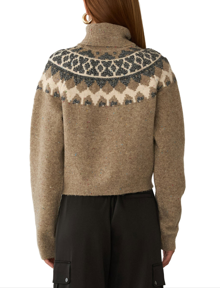 Wrap yourself in cozy charm with the Anastasia Sweater in Brown Multi. This playful turtleneck features a warm blend of brown tones that bring a lively twist to your cold-weather wardrobe. Perfect for layering or wearing on its own, it adds a fun pop of color while keeping you snug and stylish all season long.
