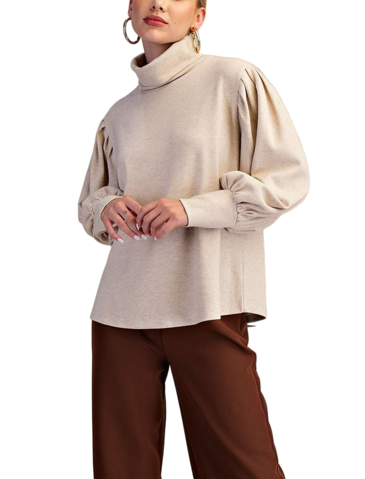 Meet the Erin Sweater, your new cozy companion for chilly days. This long sleeve turtleneck knit wraps you in warmth with a snug fit that’s perfect for layering or wearing solo. Its soft, stretchy fabric feels like a gentle hug, while the playful turtleneck adds a fun twist to your everyday wardrobe. Whether you’re sipping hot cocoa or strolling through crisp autumn air, Erin keeps you stylishly comfy and ready for anything.