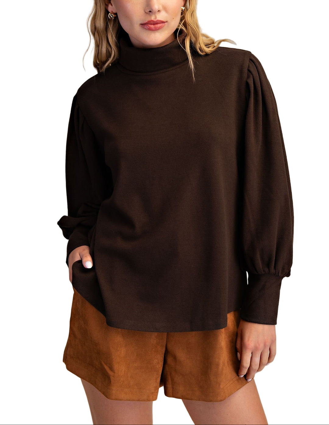 Meet the Erin Sweater, your new cozy companion for chilly days. This long sleeve turtleneck knit wraps you in warmth with a snug fit that’s perfect for layering or wearing solo. Its soft, stretchy fabric feels like a gentle hug, while the playful turtleneck adds a fun twist to your everyday wardrobe. Whether you’re sipping hot cocoa or strolling through crisp autumn air, Erin keeps you stylishly comfy and ready for anything.