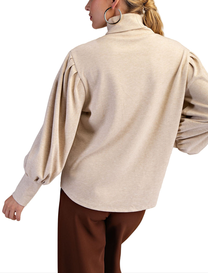 Meet the Erin Sweater, your new cozy companion for chilly days. This long sleeve turtleneck knit wraps you in warmth with a snug fit that’s perfect for layering or wearing solo. Its soft, stretchy fabric feels like a gentle hug, while the playful turtleneck adds a fun twist to your everyday wardrobe. Whether you’re sipping hot cocoa or strolling through crisp autumn air, Erin keeps you stylishly comfy and ready for anything.
