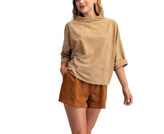 Elevate your everyday look with the Laurie Mock Neck Top, featuring a playful mock neck and flattering quarter sleeves. This top adds a fun twist to your wardrobe while keeping things effortlessly chic and comfortable. Perfect for layering or wearing solo, it’s your new go-to for a dash of style with ease