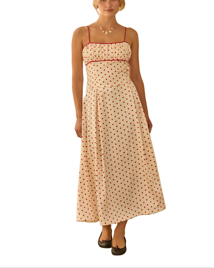 Playful yet refinded, this sleeveless midi dress features a timeless polka dot print.