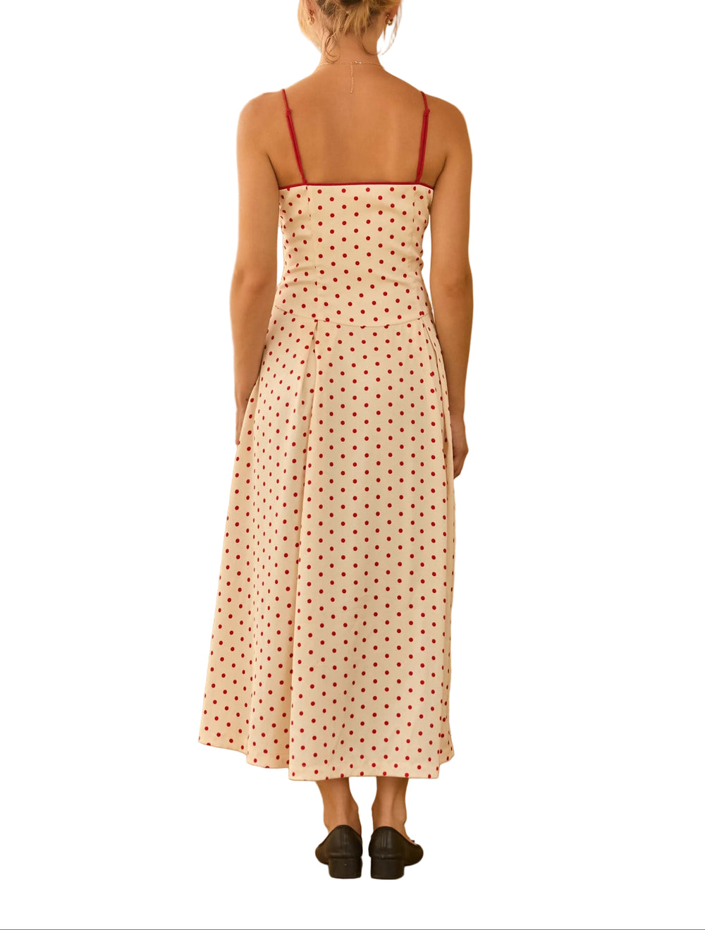 Playful yet refinded, this sleeveless midi dress features a timeless polka dot print.