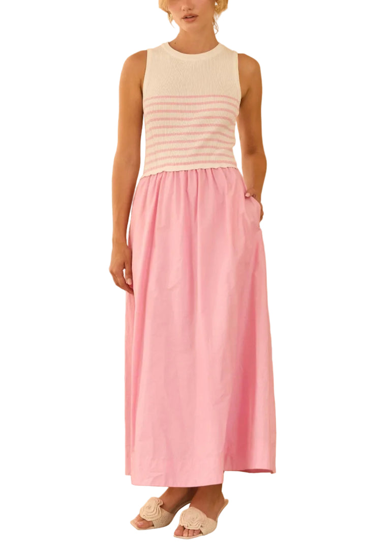 Modern and effortlessly chic, this sleeveless midi dress blends textures for a striking mixed-media effect. 