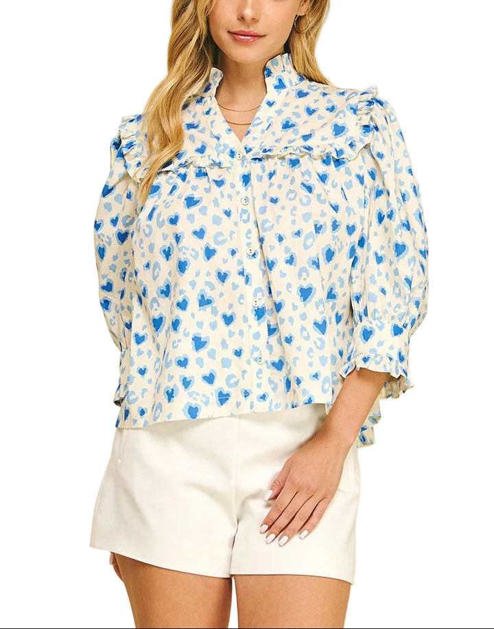 Spread the love with this charming Valerie Heart Pattern Top! Featuring an adorable heart print throughout, this playful piece combines romantic style with practical comfort. The button-down front makes dressing a breeze, while voluminous balloon sleeves add a whimsical touch. Delicate ruffle detailing frames the neckline and cuffs for extra feminine flair. Perfect for date nights, casual outings, or whenever you want to wear your heart on your sleeve—literally!