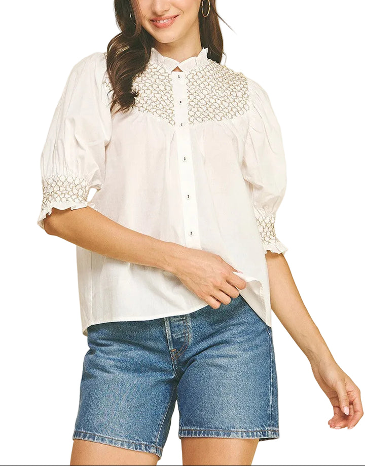 Elevate your everyday style with the Jayden Embroidered Top—a charming button-down that blends classic sophistication with whimsical flair. Featuring intricate embroidered details that catch the light just right, this versatile piece transitions seamlessly from casual weekends to polished workdays. The crisp fabric and tailored fit ensure you'll feel confident and comfortable, whether you're dressing it up with tailored trousers or keeping it relaxed with your favorite jeans. 