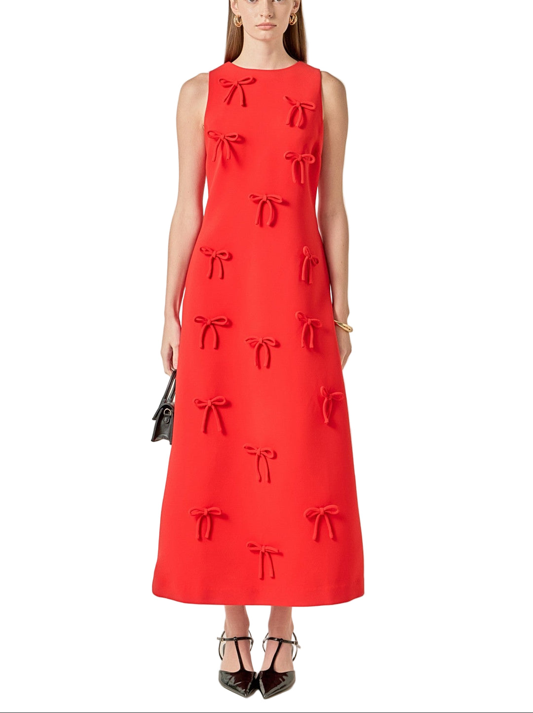 Slip into timeless elegance with this stunning red midi dress, where a charming bow detail steals the show. The flattering midi length hits just right, making it perfect for everything from brunch dates to evening celebrations. Crafted for comfort and style, this dress pairs effortlessly with heels, flats, or sneakers depending on your mood. The playful bow accent adds a touch of personality that transforms a classic silhouette into something truly special. Whether you're dressing up or keeping it casual, t