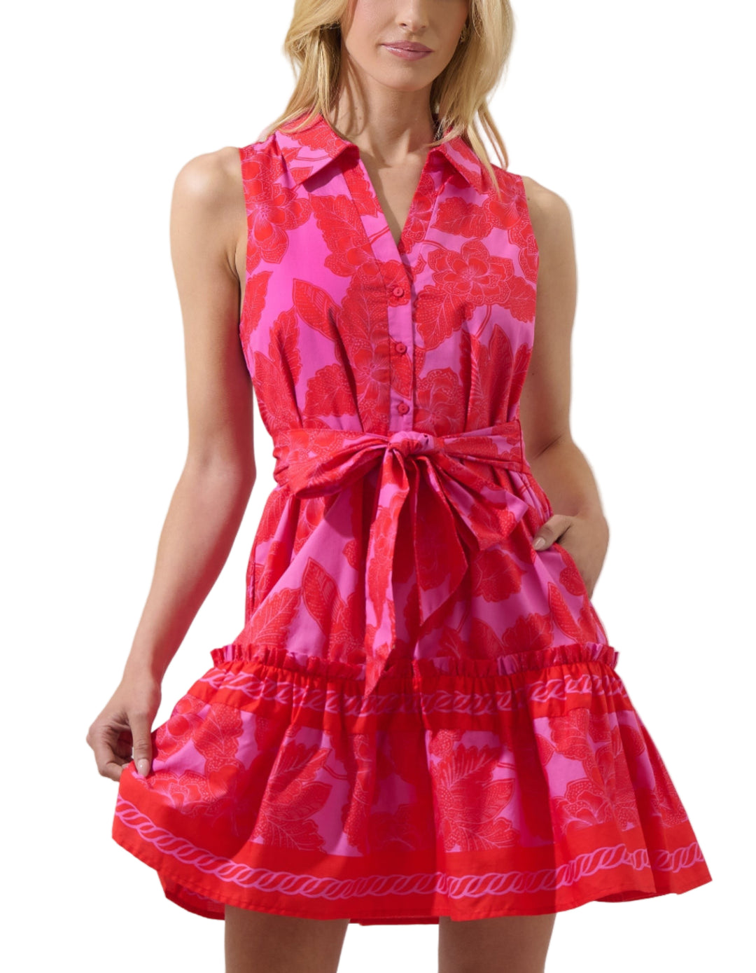 Romance is in the air. The Rency Floral Zady Sleeveless Mini Dress has a collared neck with a no sleeves. It also has a button up front with a belt around the waist. It ends with a ruffle mini hem. Wear it with a sun hat, mini bag, and flat sandals for a beachy chic ensemble
