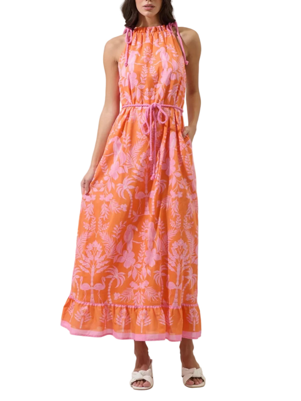 Feel like the charm that you are in the Kimana Floral Kay Halter Neck Maxi Dress. A green floral tropical print creates a sleeveless look with a ruffle halter neck tassel and another one around the waist belt. It has a maxi border with a cute design. Easy to pair with white earring and strappy heels.