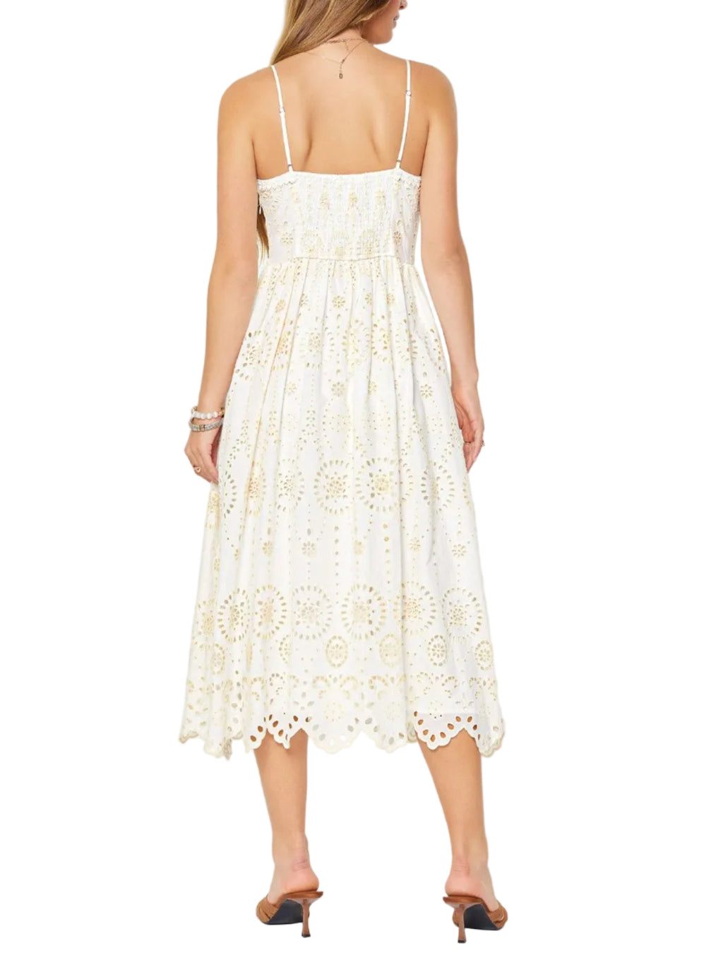 White lace dress worn by a person on a white background