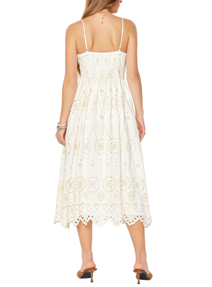 White lace dress worn by a person on a white background