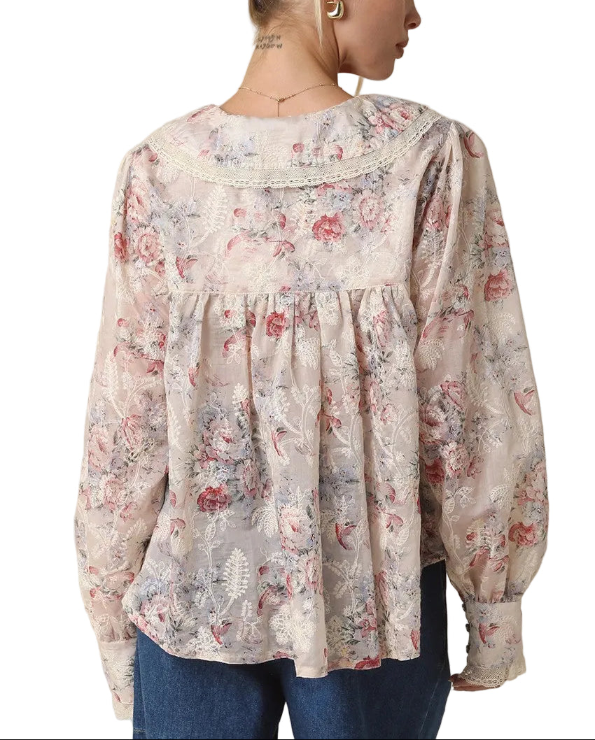 Introducing the Carla Pintuck Floral Blouse—where timeless elegance meets modern flair. This charming piece features delicate pintuck detailing that adds dimension and sophistication, while the vibrant cream, red, and green floral print brings personality to any outfit. Perfect for elevating your everyday style or dressing up for special occasions, this blouse pairs effortlessly with jeans, skirts, or tailored trousers. 