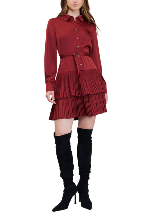 Can't go wrong with this ruby red, this high-neck shirt dress demands a closer look. Precise pleats create texture and structure at the tiers of the skirt.