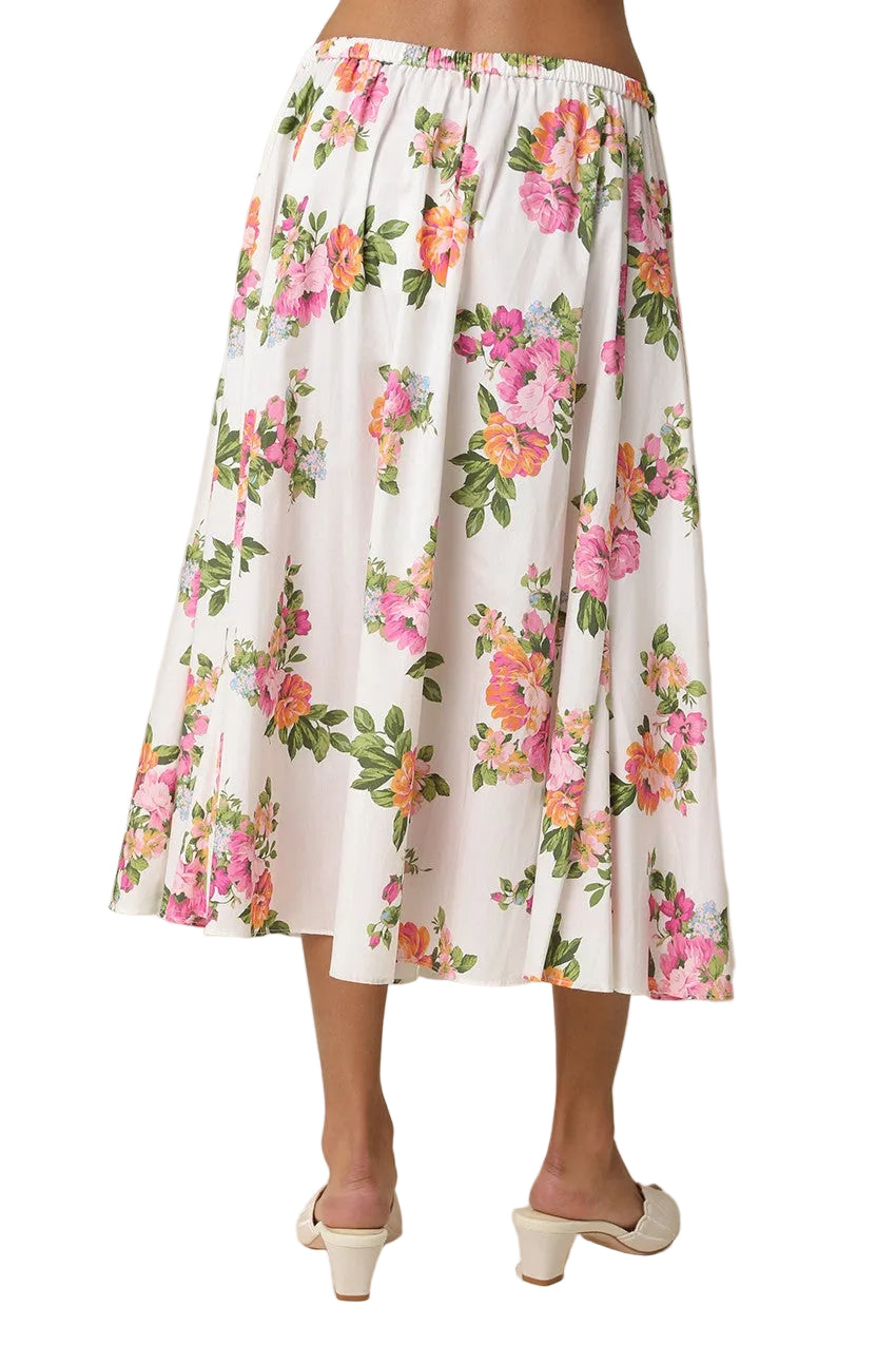 Twirl into spring with the Lilia Pleated Floral Midi Skirt—a romantic piece that brings garden-fresh charm to your everyday rotation. Delicate florals dance across soft fabric, while crisp pleats add movement and dimension with every step. The midi length hits just right for versatile styling, whether you're pairing it with sneakers for weekend wandering or dressing it up for dinner plans. A wardrobe essential that feels anything but basic.