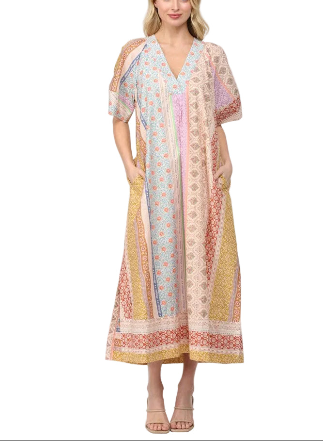 Slip into effortless elegance with the Cecelia Patchwork Print Midi Dress. This breezy kaftan-style piece features a striking patchwork print that tells its own colorful story, paired with a flattering deep V neckline that adds just the right touch of allure. Perfect for everything from beach getaways to casual weekend brunches, this midi dress moves with you in lightweight comfort. The relaxed silhouette keeps things cool and carefree, while the eye-catching pattern ensures you'll turn heads wherever you g
