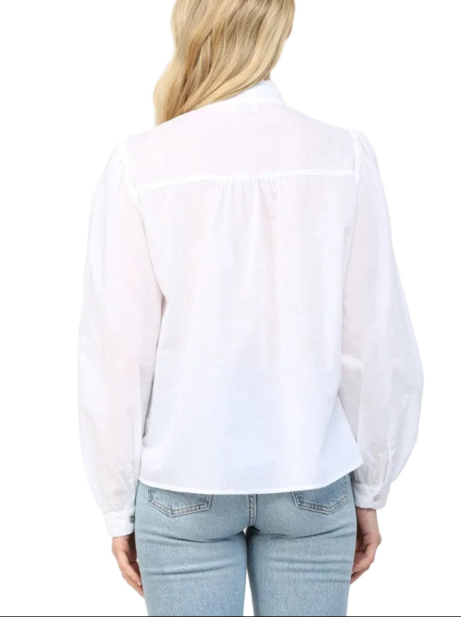 Elevate your everyday style with the Cathy Off White Blouse, a charming piece that blends classic sophistication with modern flair. This button-down beauty features a delicate lace insert at the stand collar, adding an unexpected touch of elegance and texture. Perfect for dressing up casual outfits or layering under your favorite sweaters, this versatile blouse transitions seamlessly from office to weekend adventures. 