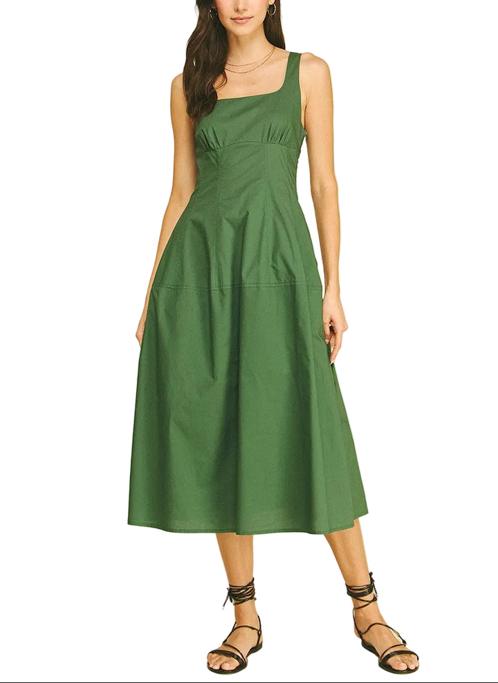 The Marisa Midi Dress offers effortless elegance for any occasion. This sleeveless design features a flattering midi length that skims the body gracefully, making it perfect for warm weather styling. The clean, minimalist silhouette pairs easily with sandals for casual outings or heels for evening events. Versatile and comfortable, it&