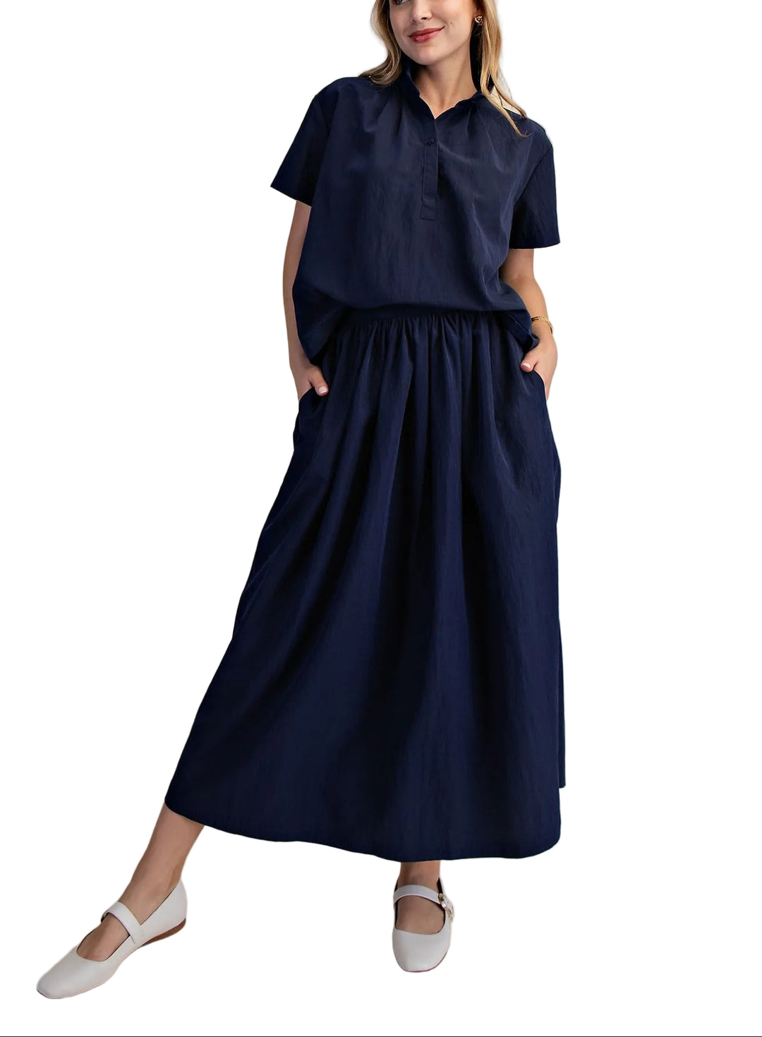 Elevate your everyday style with this versatile two-piece set. The crisp stand collar short sleeve shirt offers a polished, modern silhouette perfect for layering or wearing solo. Pair it with the flowing A-line midi skirt for an effortlessly chic look that transitions seamlessly from office to weekend. The structured shirt provides clean lines while the skirt&