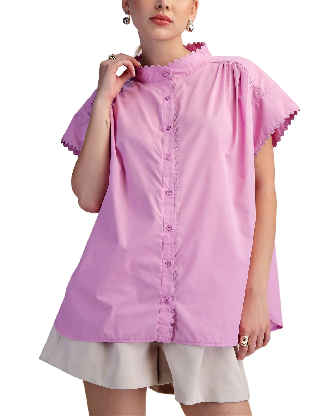 Effortless style meets comfort in the Cait Cap Sleeve Shirt. This oversized silhouette drapes beautifully for a relaxed, modern look that works from casual coffee runs to laid-back weekends. The structured cap sleeves add a touch of polish without the fuss, while the generous fit ensures you can move freely and breathe easy. Perfect for layering or wearing solo, it's the go-to piece that makes getting dressed feel like a breeze.