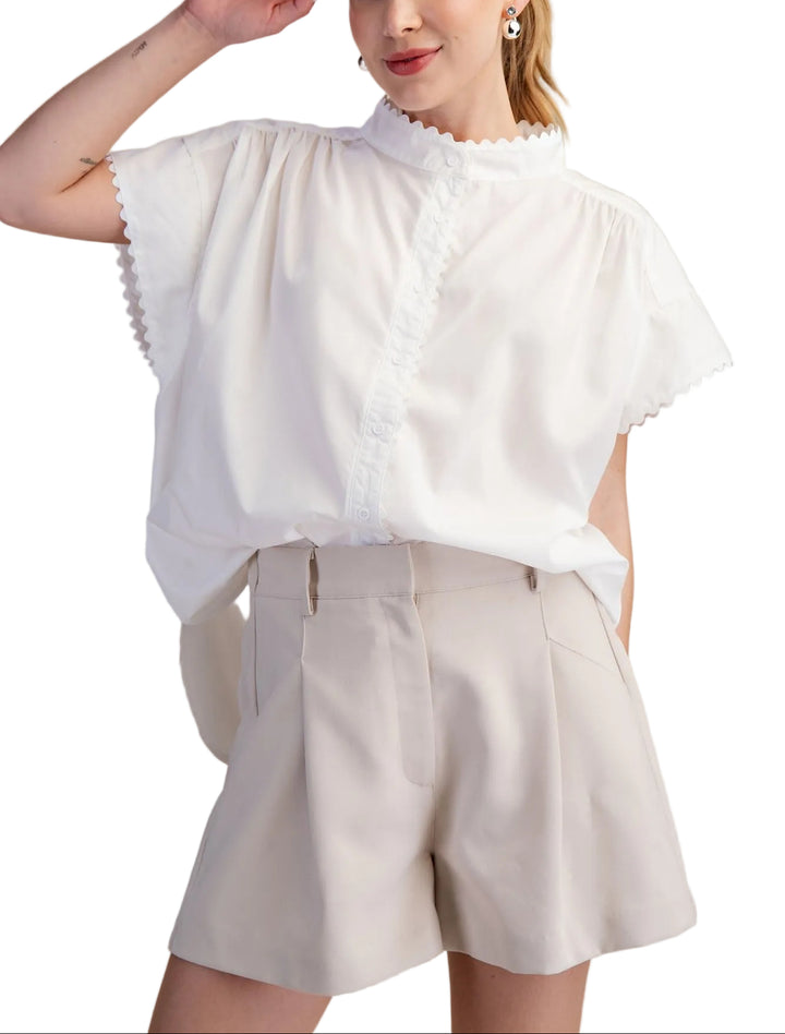 Effortless style meets comfort in the Cait Cap Sleeve Shirt. This oversized silhouette drapes beautifully for a relaxed, modern look that works from casual coffee runs to laid-back weekends. The structured cap sleeves add a touch of polish without the fuss, while the generous fit ensures you can move freely and breathe easy. Perfect for layering or wearing solo, it's the go-to piece that makes getting dressed feel like a breeze.