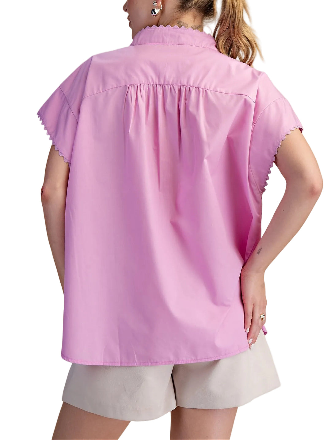 Effortless style meets comfort in the Cait Cap Sleeve Shirt. This oversized silhouette drapes beautifully for a relaxed, modern look that works from casual coffee runs to laid-back weekends. The structured cap sleeves add a touch of polish without the fuss, while the generous fit ensures you can move freely and breathe easy. Perfect for layering or wearing solo, it's the go-to piece that makes getting dressed feel like a breeze.