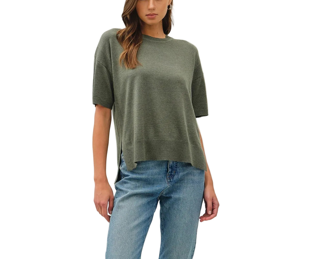 The Bella Boxy Fit Sweater delivers effortless style with its relaxed, oversized silhouette. Crafted for comfort, this short sleeve design is perfect for layering or wearing solo during warmer months. The structured boxy cut flatters all body types while maintaining a contemporary, fashion-forward look. Ideal for casual everyday wear, weekend outings, or dressed up with tailored pieces. Soft and breathable fabric keeps you comfortable throughout the day.
