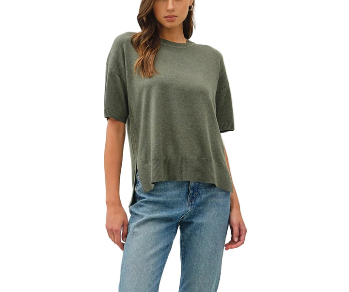 The Bella Boxy Fit Sweater delivers effortless style with its relaxed, oversized silhouette. Crafted for comfort, this short sleeve design is perfect for layering or wearing solo during warmer months. The structured boxy cut flatters all body types while maintaining a contemporary, fashion-forward look. Ideal for casual everyday wear, weekend outings, or dressed up with tailored pieces. Soft and breathable fabric keeps you comfortable throughout the day.