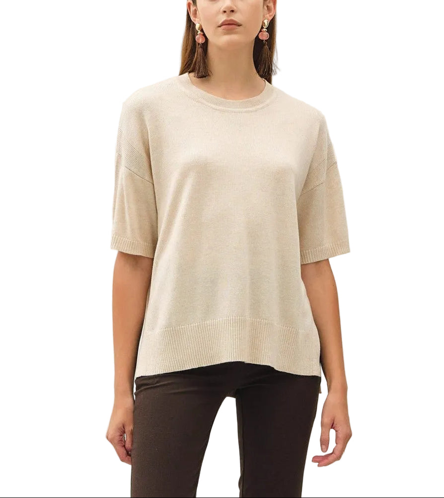 The Bella Boxy Fit Sweater delivers effortless style with its relaxed, oversized silhouette. Crafted for comfort, this short sleeve design is perfect for layering or wearing solo during warmer months. The structured boxy cut flatters all body types while maintaining a contemporary, fashion-forward look. Ideal for casual everyday wear, weekend outings, or dressed up with tailored pieces. Soft and breathable fabric keeps you comfortable throughout the day.