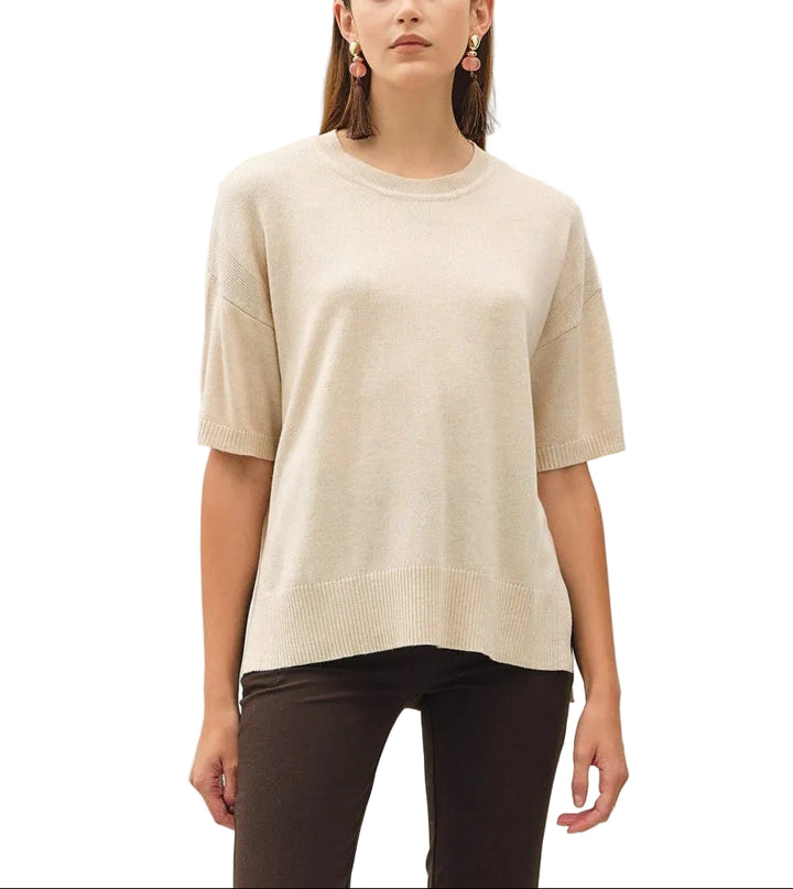 The Bella Boxy Fit Sweater delivers effortless style with its relaxed, oversized silhouette. Crafted for comfort, this short sleeve design is perfect for layering or wearing solo during warmer months. The structured boxy cut flatters all body types while maintaining a contemporary, fashion-forward look. Ideal for casual everyday wear, weekend outings, or dressed up with tailored pieces. Soft and breathable fabric keeps you comfortable throughout the day.