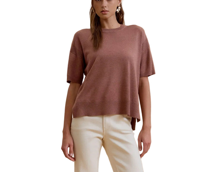 The Bella Boxy Fit Sweater delivers effortless style with its relaxed, oversized silhouette. Crafted for comfort, this short sleeve design is perfect for layering or wearing solo during warmer months. The structured boxy cut flatters all body types while maintaining a contemporary, fashion-forward look. Ideal for casual everyday wear, weekend outings, or dressed up with tailored pieces. Soft and breathable fabric keeps you comfortable throughout the day.