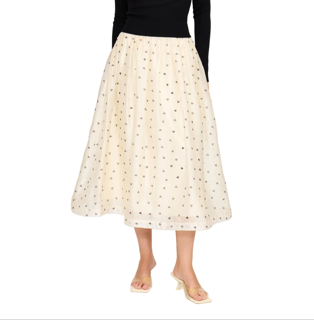 Twirl into your day with the Cassie Midi Skirt, a charming piece that celebrates love in every step. Featuring an adorable heart print against a lined silhouette, this midi skirt offers the perfect balance of whimsy and sophistication. The lined construction ensures comfort and confidence, while the flattering length works beautifully for everything from casual outings to date nights. A delightful addition to any wardrobe that proves romance never goes out of style.