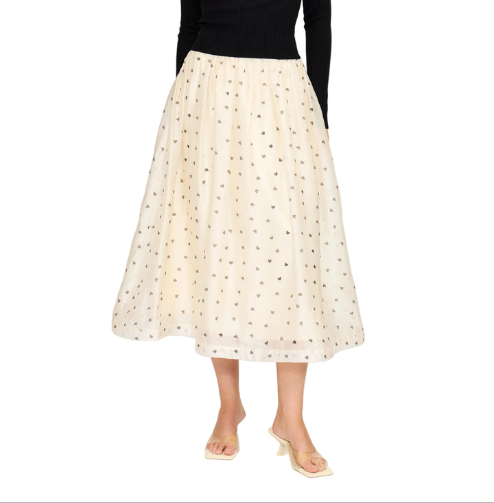 Twirl into your day with the Cassie Midi Skirt, a charming piece that celebrates love in every step. Featuring an adorable heart print against a lined silhouette, this midi skirt offers the perfect balance of whimsy and sophistication. The lined construction ensures comfort and confidence, while the flattering length works beautifully for everything from casual outings to date nights. A delightful addition to any wardrobe that proves romance never goes out of style.