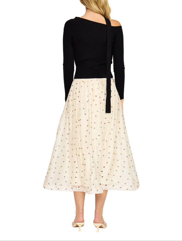 Twirl into your day with the Cassie Midi Skirt, a charming piece that celebrates love in every step. Featuring an adorable heart print against a lined silhouette, this midi skirt offers the perfect balance of whimsy and sophistication. The lined construction ensures comfort and confidence, while the flattering length works beautifully for everything from casual outings to date nights. A delightful addition to any wardrobe that proves romance never goes out of style.