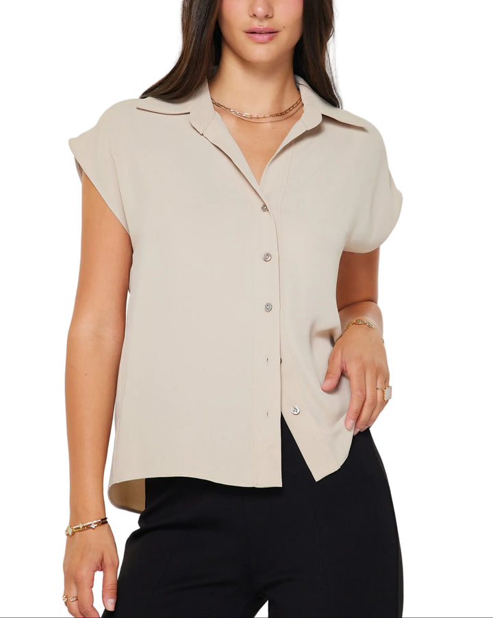 Classic collar neckline with button-down top
Short cap sleeves
Relaxed fit
Sustainable lightweight fabric
Gentle cycle wash in cold water
100% RECYCLED POLY