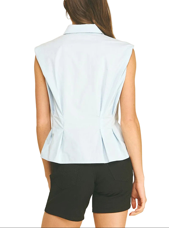 Effortless elegance meets modern style with the Molly Sleeveless Shirt in Light Blue. This versatile button-down features a flattering peplum waist that adds dimension and movement to your silhouette. The sleeveless design keeps you cool and comfortable, while the crisp button front allows for easy layering or standalone wear. Perfect for office settings, casual outings, or weekend brunch—dress it up with tailored trousers or down with your favorite denim. 